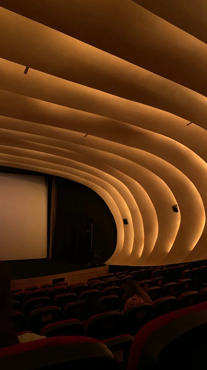 Luxurious boutique cinema interior with ambient lighting